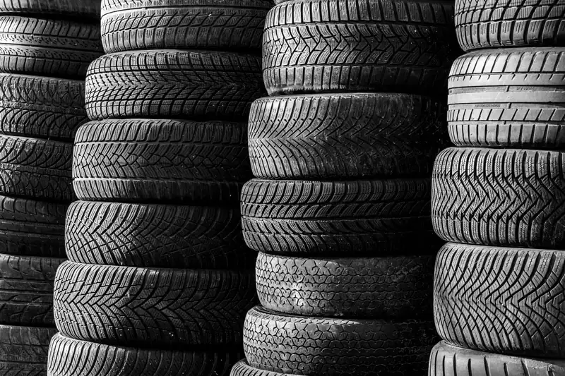 Stacks of new tires showing different tread patterns
